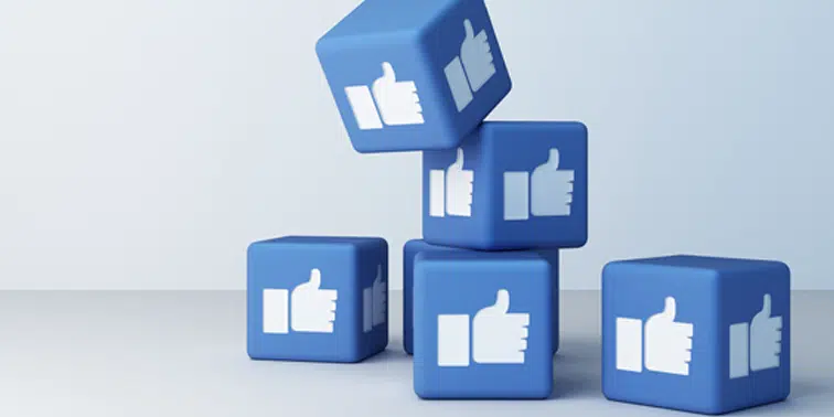 Blue blocks with white thumbs-up icons representing social media engagement and digital marketing strategies.