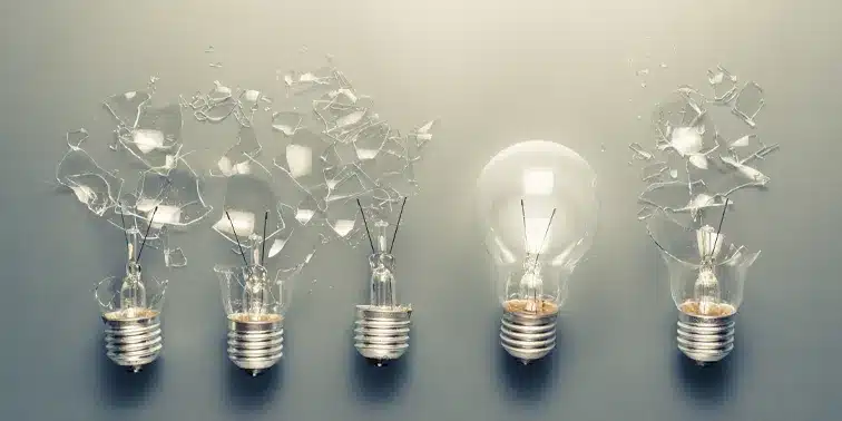 Lightbulbs in various states of transformation, symbolising innovative ideas and the evolution of content marketing strategies.