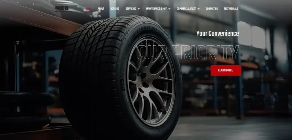 Close-up of a car tyre on a workshop floor, featuring the MEB Car Mechanic branding and a text overlay stating "Your Convenience Our Priority," highlighting automotive services and customer focus in a modern garage setting.